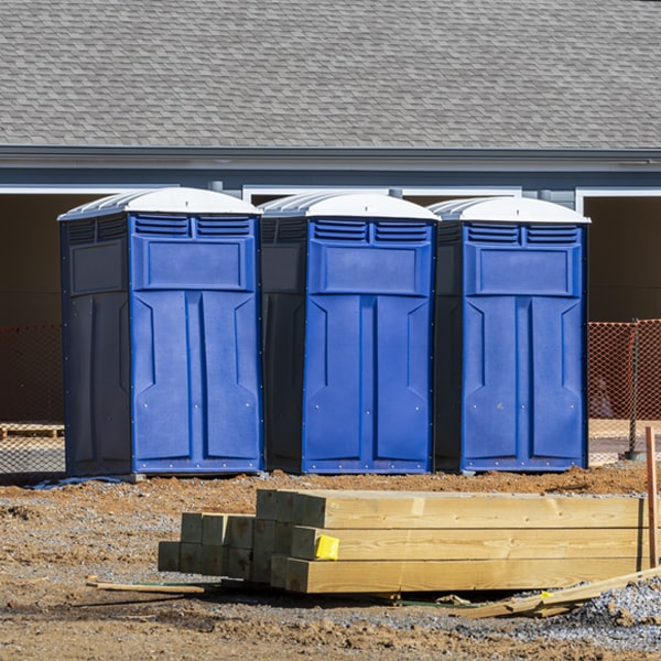 what is the cost difference between standard and deluxe portable restroom rentals in Absaraka